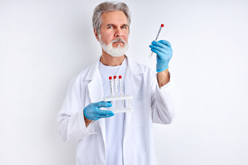 doctor holding a test tube of liquid solution in a laboratory, preparing results. epidemic pandemic...