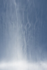 Fototapeta na wymiar Natural art created by clouds like cotton wool against a blue sky.