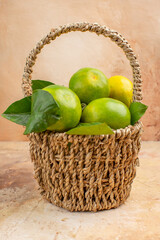 front view fresh green tangerines inside basket on a light background mellow fruit photo juice xmas color