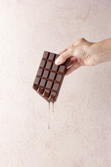 hand with chocolate