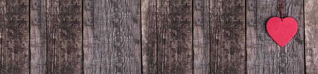 Heart shapes on rustic wooden background. Long banner
