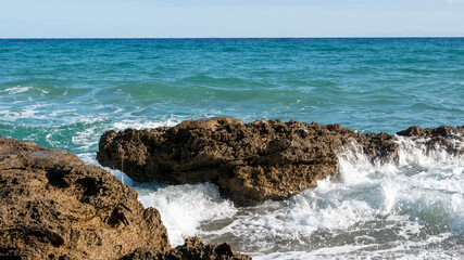 waves crashing on rocks