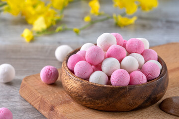 Raw red and white tangyuan on wooden table background for Winter solstice food.