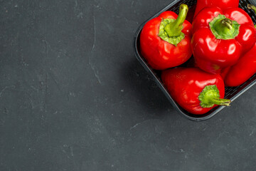 top view red bell-peppers spicy vegetables on dark background hot color photo spice salad meal free space