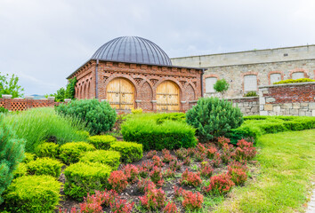Scenic view of garden with dome building in background in Rabati castle site.