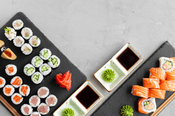 Maki sushi set served on black stone tray