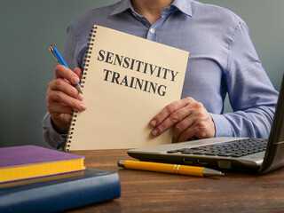 Sensitivity training concept. The manager holds the documents.