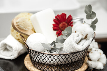 Spa composition with bath accessories in a basket close up.