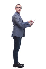 Side view of smiling business man using his tablet computer