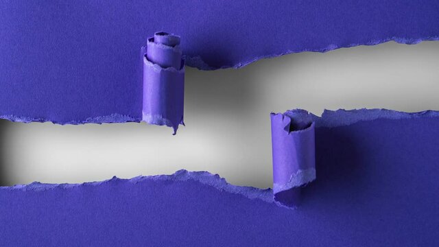 Blue paper is torn over white background for message, stop motion, animation. Template for your text.
