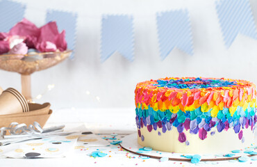 Colorful big handmade birthday cake on the holiday table