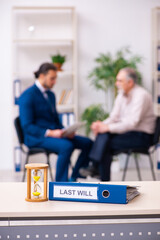 Young male lawyer and old man in testament and time management c