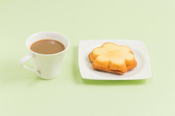 Coffee and a snack with a smiley face on it
