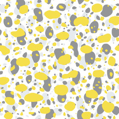 Seamless vector pattern of spots. Background abstract elements in yellow, gray, and white. Hand-drawn texture in a simple style