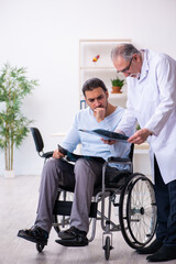 Young man in wheel-chair and old doctor radiologist
