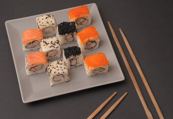 Sushi on stone dark background.