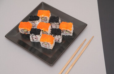 Sushi on stone dark background.
