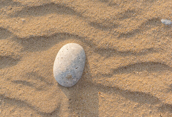 Fototapeta na wymiar stones on the sand on the beach