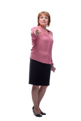 Fototapeta premium Portrait of a happy senior woman pointing upwards, isolated on a white background