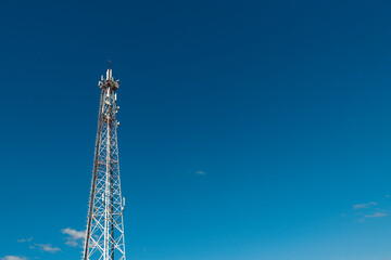 communication tower against a blue sky