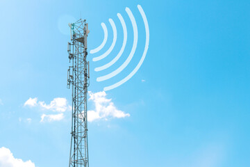 a radio tower with antennas that broadcasts a signal against the background of a blue sky with clouds