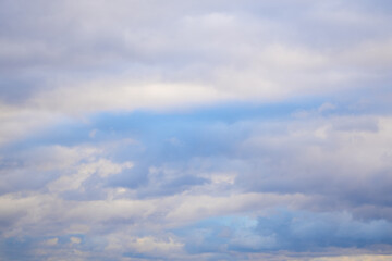 Saturated clouds move through the sky during the day. A harbinger of rain. Weather