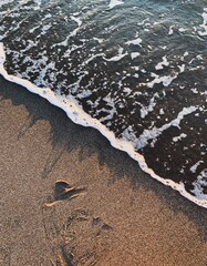 Wave running on the sand background