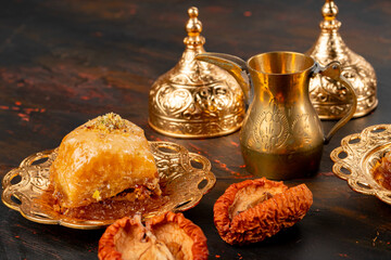 Piece of Turkish baklava in golden arabic plate