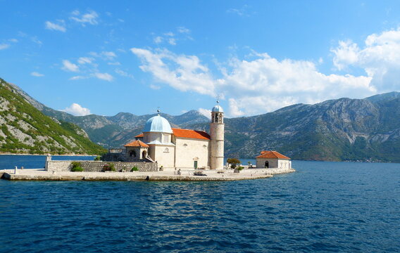 Ancient church Our Lady of the Rocks (Gospa od Skrpjela) and St. George Island in Perast, Boka Kotor Bay in Montenegro. Island of Virgin on reef. Name of island means Madonna Mother of God on Reef.