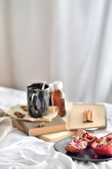 Natural  flu home remedies: hot tea cups with lemon and walnut and pomegranate to boost immune system. Natural healthy food and hot drink ingredients for immunity stimulation and against viruses.