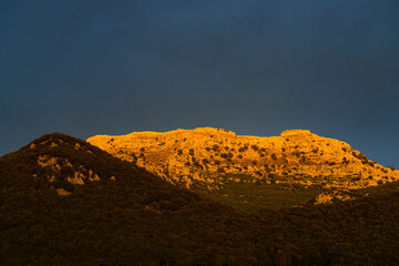 Sunset storm lights over Mount Candina in the Liendo Valley, Eastern Coastal Mountain. Liendo. Cantabrian Sea, Cantabria, Spain, Europe