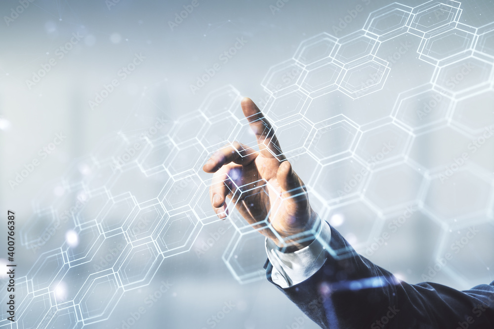 Poster man hand clicks on abstract virtual wireless technology hologram with hexagon on blurred office back
