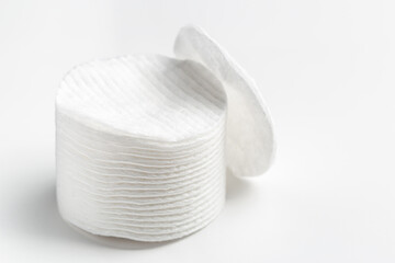 Cotton pads stack on gray background © bymandesigns