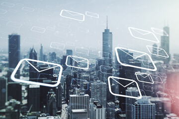 Abstract virtual postal envelopes hologram on Chicago cityscape background, email and notification concept. Multiexposure
