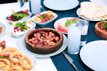 Turkish and Greek Traditional Dinning Table with Special Alcohol Drink Raki. Ouzo and Turkish Raki...
