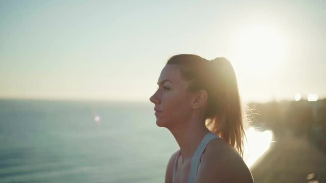young spanish woman doing sport at the beach in the mediterranean sea