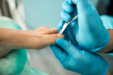 Focused photo on male hands holding nail clippers