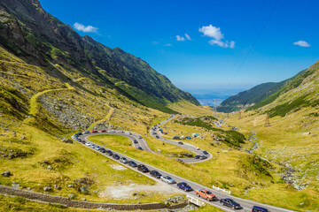 Panoramic mountain road Transfagarasan, the most beautiful road in Europe, Romania Transfagarash Ridge Fagaras. Scenic view at canyon in Carpathian mountains, Transylvania. Summer sunday traffic jam