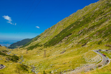 Panoramic mountain road Transfagarasan, the most beautiful road in Europe, Romania Transfagarash Ridge Fagaras. Scenic view at canyon in Carpathian mountains, Transylvania. Summer sunday traffic jam