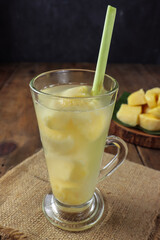 wedang tape or wedang tapai, traditional drink from fermented cassava doused with warm water then stirred and served warm.