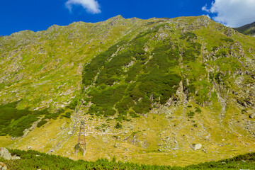 Majestic landscape of summer mountains. View of hills in rays of sunlight. Fagaras. Amaizing view...
