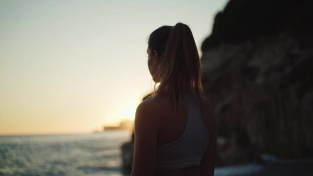 young spanish woman doing sport at the beach in the mediterranean sea