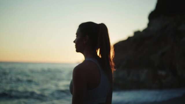 young spanish woman doing sport at the beach in the mediterranean sea