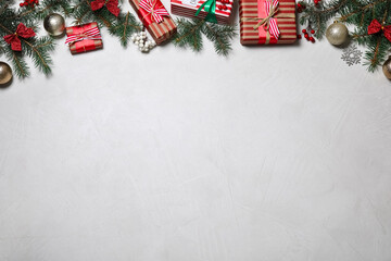 Fototapeta na wymiar Flat lay composition of color Christmas gift boxes on light background. Space for text