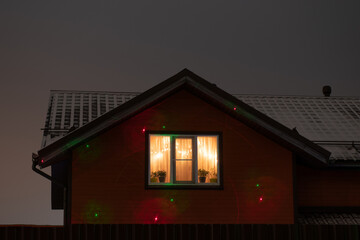 Windows decorated with festive lights in the evening