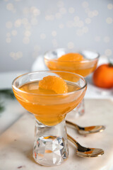 Delicious tangerine jelly on white marble board