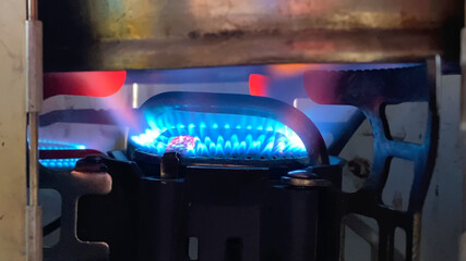 Travel gas burner. Blue flame from a gas burner close-up.