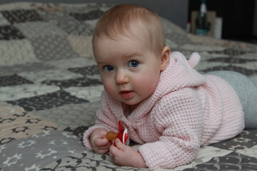 Portrait of a baby girl with red apple