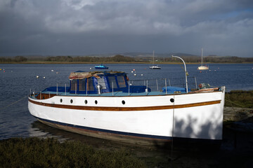 An Elegant old motor boat moored at Dell Quay England on the estuary.