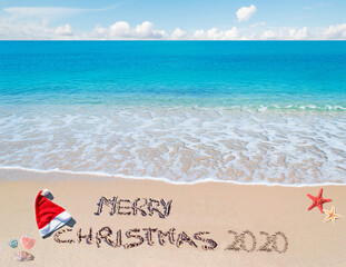 Merry Christmas 2020  written on the sand